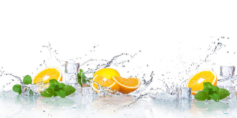 Wall Mural - ice cubes, mint leaves with oranges isolated on a white background