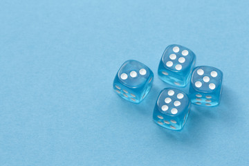 Blue dices on blue background.