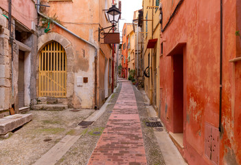 Wall Mural - Menton. Old narrow street in the historic part of the city.