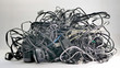 A low angle shot of  a large bundle of used multi-colored electronic cords and cables to be recycled for copper, brass, and other valuable metals.