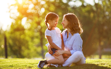 Canvas Print - happy family mother and child daughter in nature   in summer