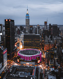 Fototapeta Nowy Jork - view from top on Madison Square Garden and Empire State Building. Night Lights