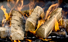 Dried Logs Of Wood Burning In A Barbecue
