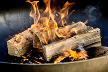 Burning Logs Flaming In A Barbecue Fire