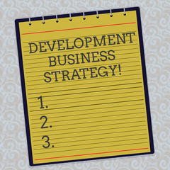 Fototapete - Handwriting text Development Business Strategy. Concept meaning Longterm business planning Strategic plan Lined Spiral Top Color Notepad photo on Watermark Printed Background