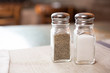A salt and pepper shaker in a restaurant setting
