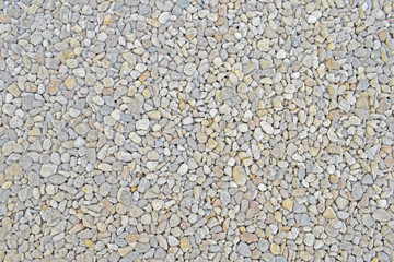 Light grey small pebble. Stones texture. Natural background. Dry gravel.