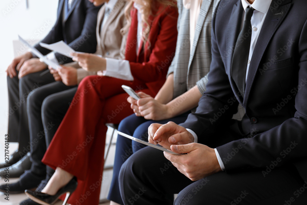 Young people waiting for job interview indoors