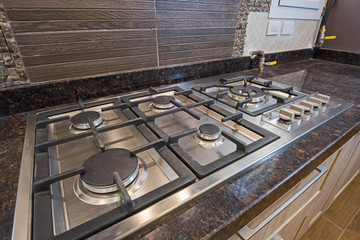 Wall Mural - Modern kitchen cooker hob in a luxury apartment