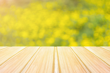 Wall Mural - Empty blue wooden table with blurred city park on background. concept party, products, summer background