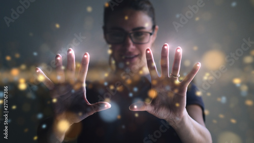 Fotomural Portrait of an young man is using the futuristic latest innovation technology with augmented reality hologram