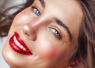 Beauty portrait of sexy young woman with red lips. Pure and nude make up.