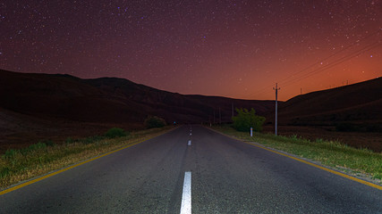 Wall Mural - empty night road over starry sky