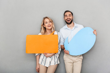 Attractive young couple standing isolated