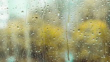 Rain Drops On The Window. Rainy Window In Autumn Or Spring. Abstract View. Rainy Season. Droplets On Glass Window  Shield. 