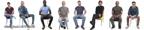 Fotomural group of mixed man sitting on chair on white background