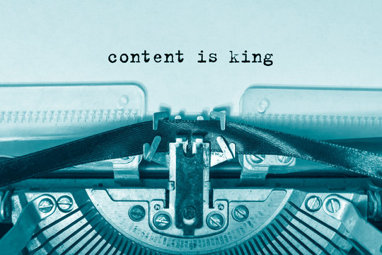 content is king printed on a white sheet of paper on a vintage typewriter.