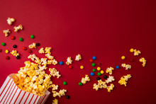 Popcorn Bag With Chocolate Candy Background