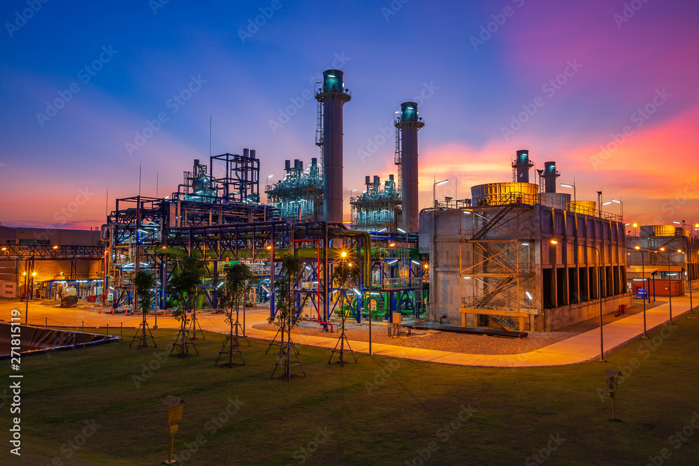 Electric plant turbine generator in the power supply plant in the industry area during twilight time - obrazy, fototapety, plakaty 