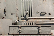 Metal Parts Of The Body Of Military Equipment Close-up. Armored War Machine. Steampunk Background