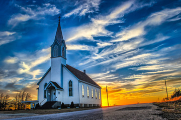 ellis county, ks usa - a lone church at dusk in the western kansas prairie
