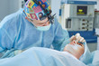 © lenetsnikolai - Several doctors surrounding patient on operation table during t
