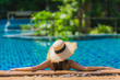 © siraphol - Portrait beautiful young asian woman leisure relax smile and happy around swimming pool in hotel resort