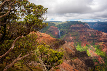 Waipo'o Falls, Waimea Canyon, Kauai, Hawaii. Waipo'o Falls is a fantastic waterfall on Kokee Stream dropping 800 ft. in two tiers. It is located in the heart of the Waimea Canyon.