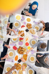 Wall Mural - top view of modern multiethnic muslim family having a Ramadan feast