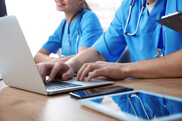 Canvas Print - Medical students studying at table, closeup view