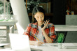 woman girl teenager freelancer talking on phone writing note