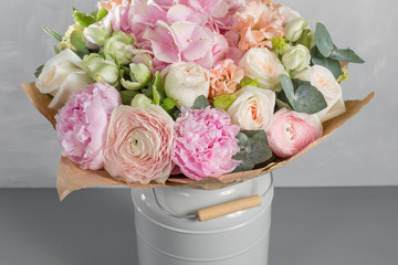 delicate, pastel coloured Small Beautiful bouquet of mixed flowers. Floral shop concept . Beautiful fresh cut bouquet. Flowers delivery