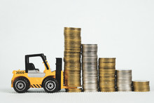 Mini Forklift Truck With Coin Stack, Business Finance And Banking Industrial Concept.