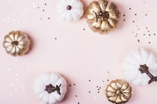 Golden Pumpkins Frame On Pastel Pink Background. Autumn Holiday Sale Concept