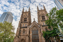 The Western Towers Of Sydney's St Andrew's Cathedral Against A Dramatic Sky, Australia