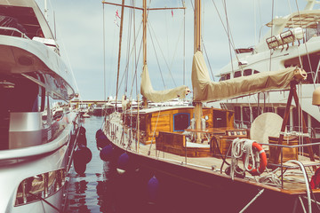 Wall Mural - Yachts docked at Port Hercules in La Condamine harbour. Cityscape of Monte Carlo. Principality of Monaco..