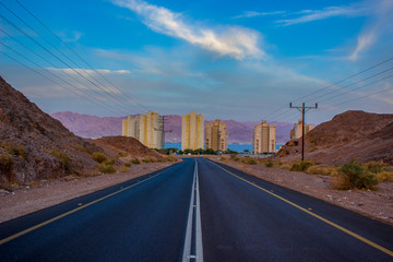 beautiful outskirts scenic entrance road to the city with buildings and streets landscape and landmark colorful photography 