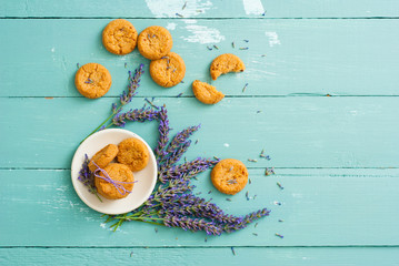 Wall Mural - stack of lavender cookies on enamel plate, aged blue wooden table