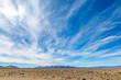 Wispy clouds over a vast desert landscape, along the Extraterrestrial Highway in Nevada