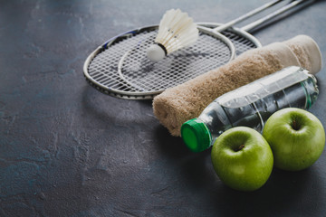 Wall Mural - Badminton rackets with apples and water bottle