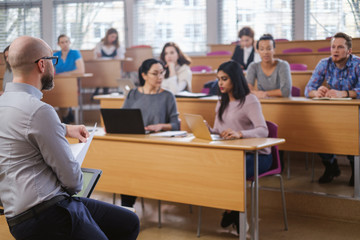 multinational group of students in an auditorium