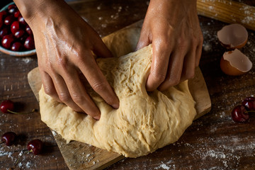 Wall Mural - preparing a coca de cireres, a cherry flat cake