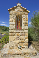 Wall Mural - Detail of a chapel in the Provence, France against a dark blue sky