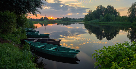 Wall Mural - boats on the lake at the sunrise