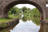 Fototapeta Do pokoju - view from under bridge over canal