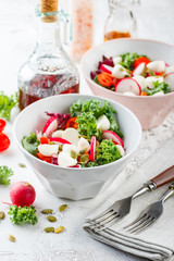 Wall Mural - Salad with cherry tomatoes, radsh and mozzarella, lettuce mix