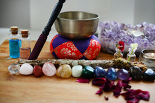 Healing Crystals, Fresh Herbs, And Tibetan Singing Bowl. Rainbow Crystals On Wood Table, Candles, And Singing Bowl. Witches Alter, Bohemian Decorations. Wiccan Crystal Grid, Rainbow Design. 