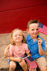 Little boys watching fourth of July Parade