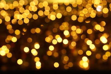 Wall Mural - Abstract blurred and bokeh of party yellow LED reflection lighting on night time background.