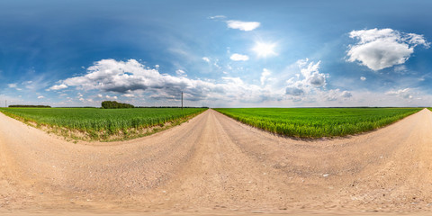 Wall Mural - full seamless spherical hdri panorama 360 degrees angle view on gravel road among fields in summer d
